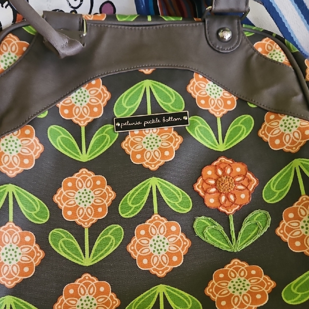 Petunia Pickle Bottom Green and Orange Baby Bag with Floral Design